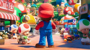 Art from The Super Mario Bros. poster, Mario looks over the mushroom kingdom as Toad leads him forward through a crowd of multicolored Toads.