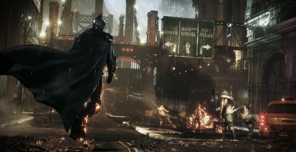 Batman walking through the streets in Arkham Knight. wb games